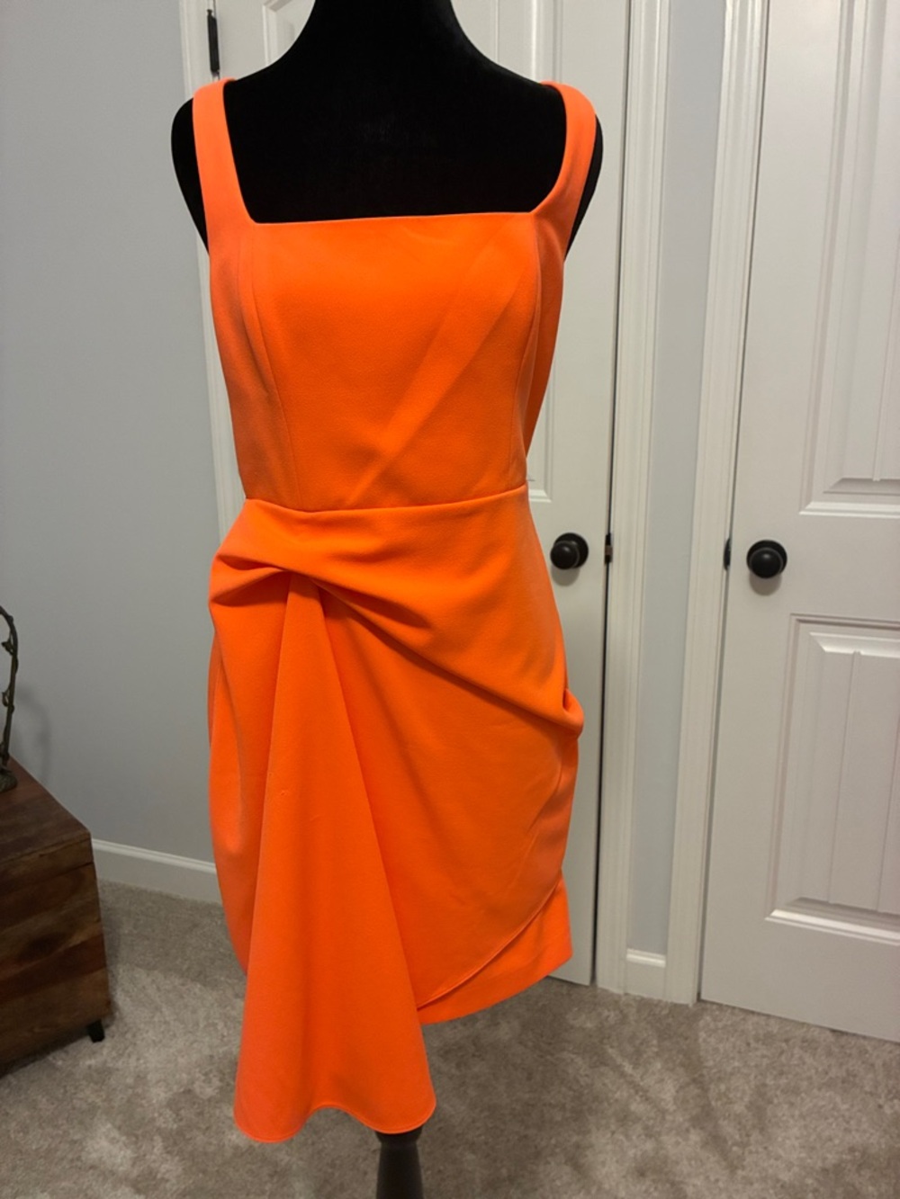 Sleeveless Orange Draped Sheath Dress by Belle Badgley Mischka.